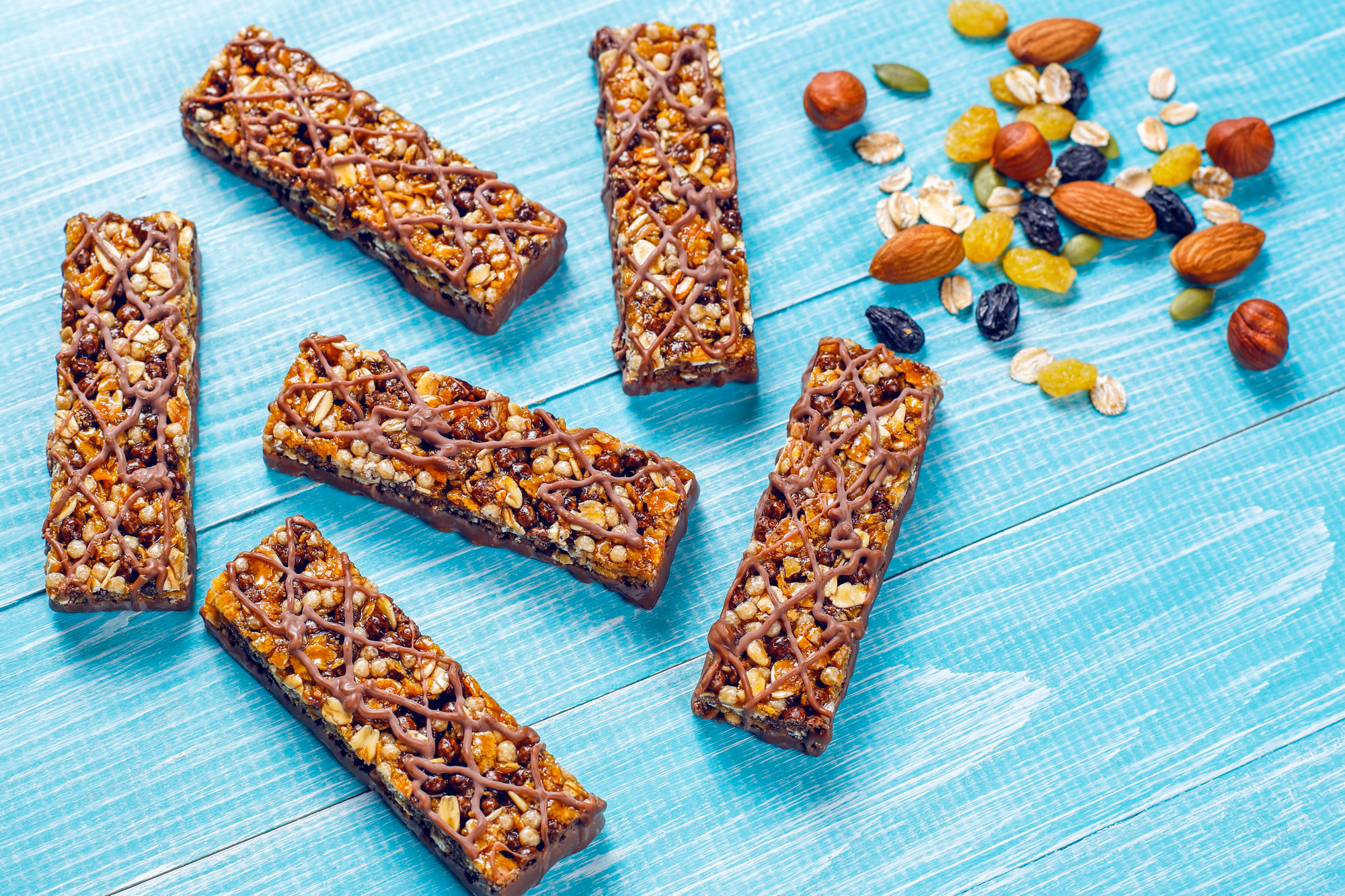 : Protein bars displayed as a convenient and nutritious snack, commonly consumed to support muscle recovery and energy needs.