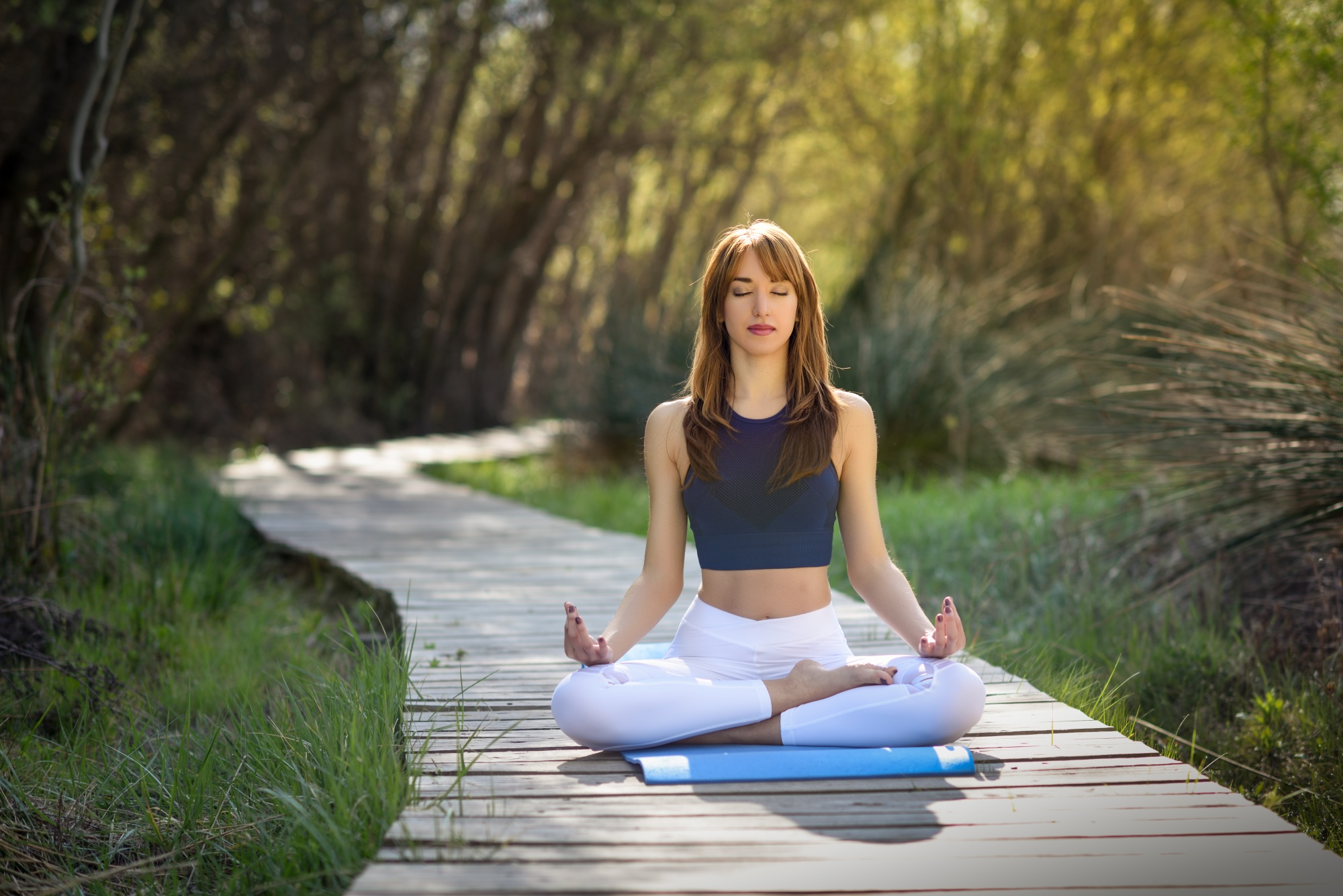A person practicing yoga breathing exercises in a calm environment, highlighting natural techniques to improve focus, concentration, and mental well-being.