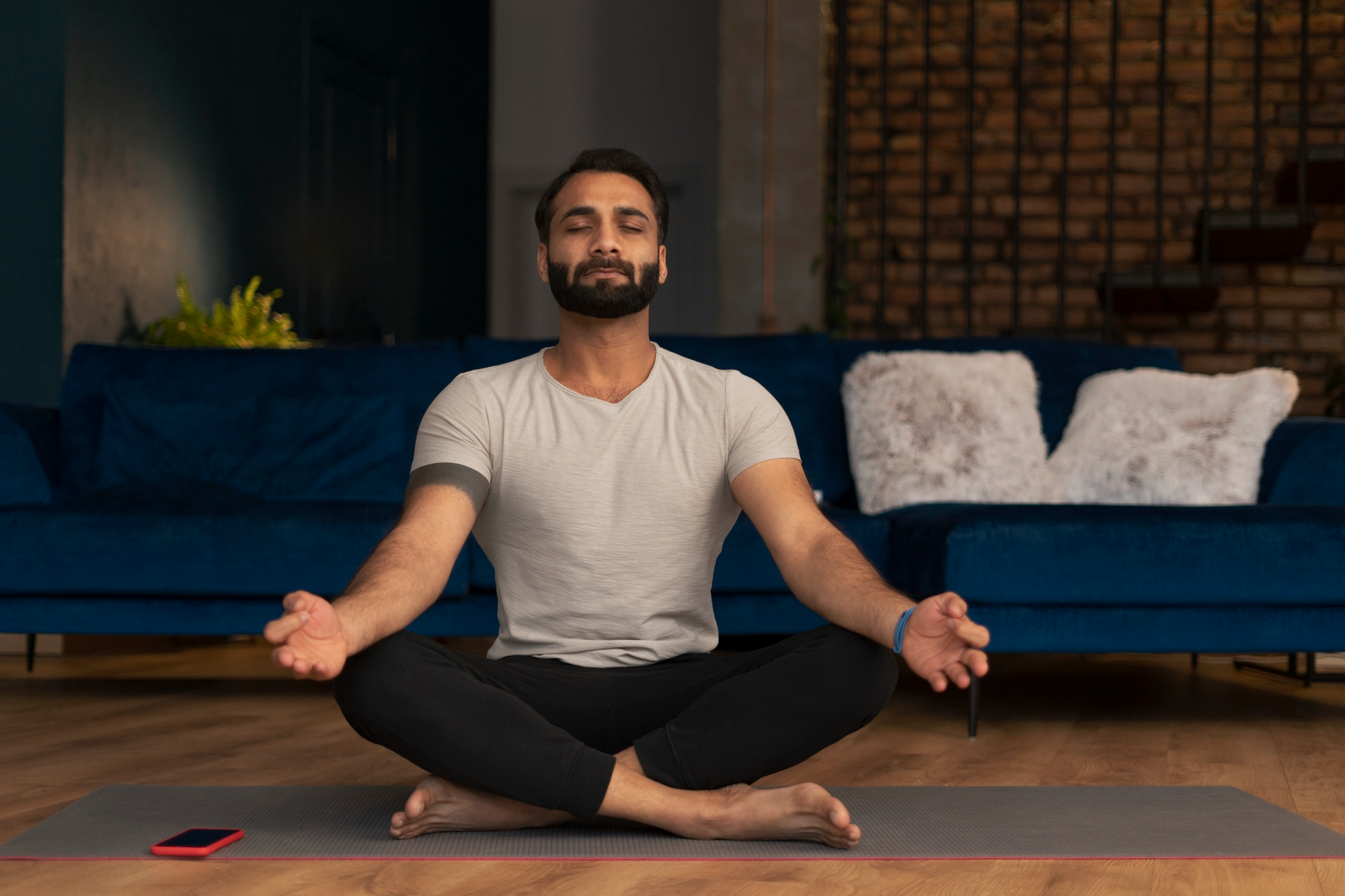 Man practicing yoga at home for health and wellness.