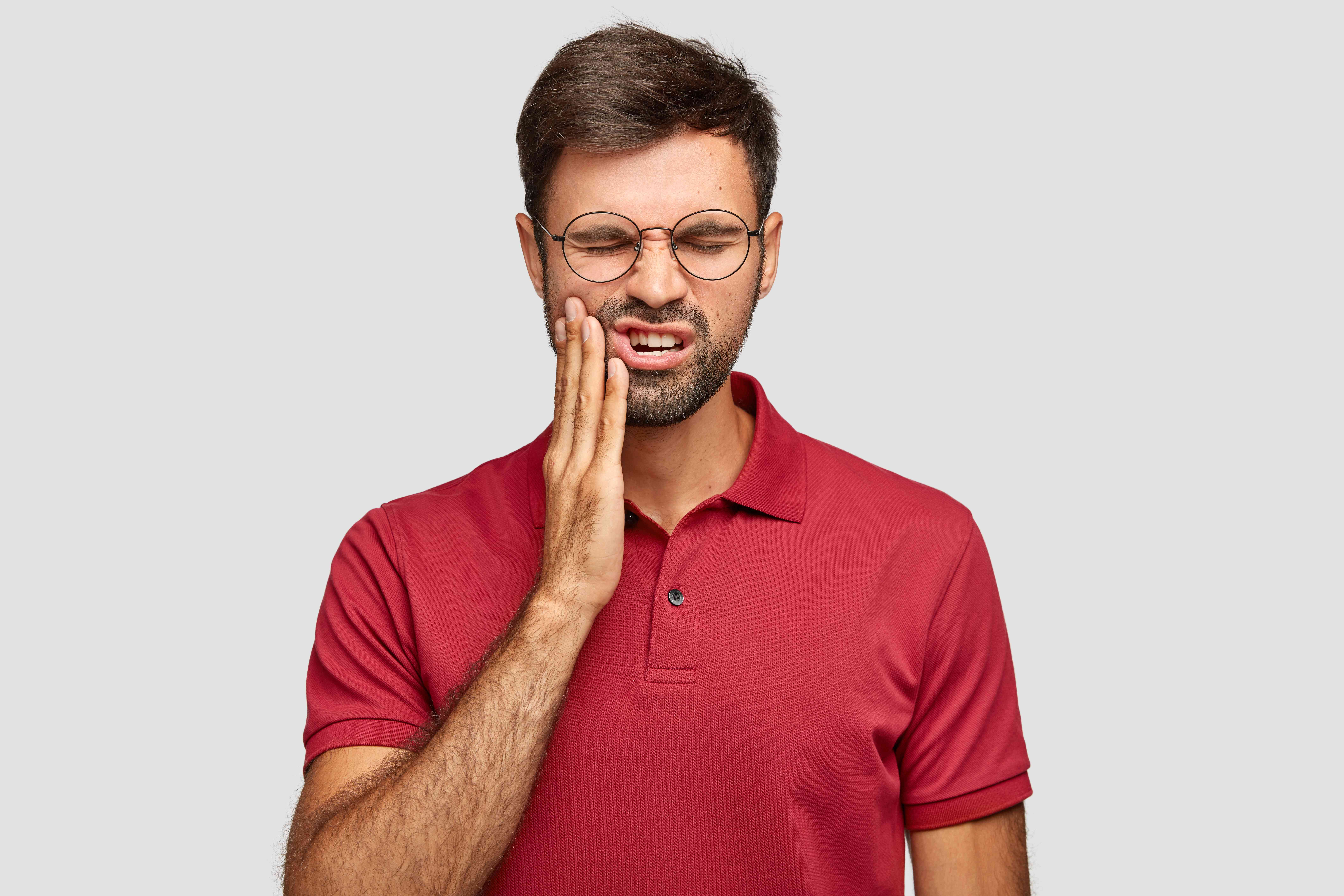 photo-caucasian-man-suffers-painful-toothache-has-rotten-tooth-needs-visit-dentist (1)-compressed