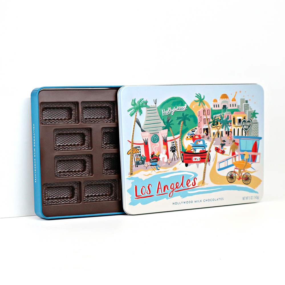 Rectangular tin container with chocolates inside