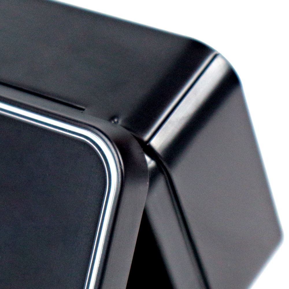 Tin box with a hinged lid showcasing elegant embossing