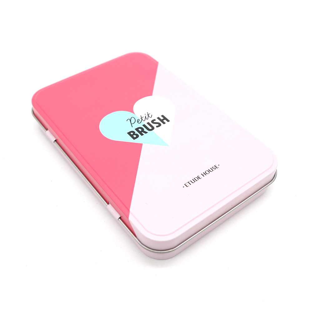 Custom rectangular cosmetic tin box used for lip balm packaging, with a branded design.