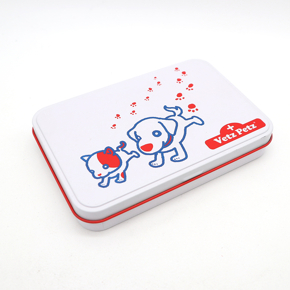 Close-up view of a metal hinge top tin container with a glossy finish for cosmetic brush set storage.