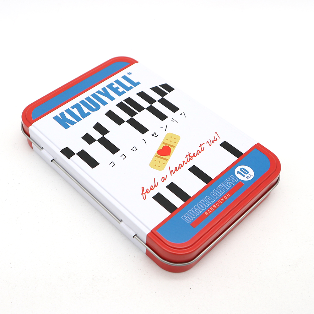 Metal hinge top tin container placed on a vanity with brushes inside for organized storage.