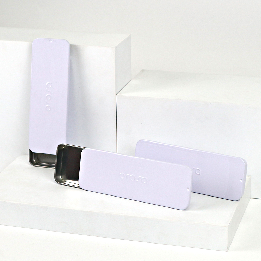 Close-up of a premium custom rectangular tin box for lip balm with a sliding lid.