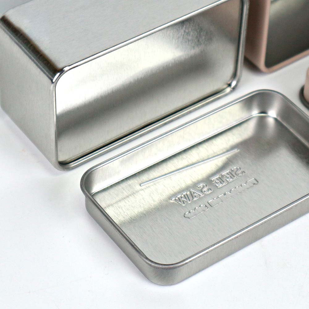 Stylish rectangular metal fragrance soap tin container with a sleek and elegant design, perfect for packaging scented soaps.