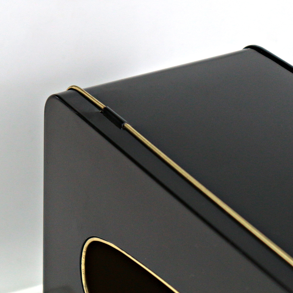 Custom rectangular tissue tin box with window lid displayed in a home living room, providing both style and functionality.