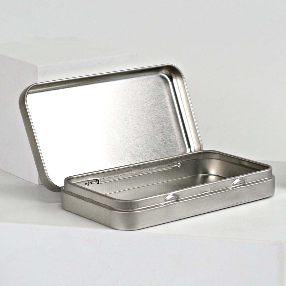 Soft pastel-colored cosmetic tin box with a hinged lid, perfect for holding makeup or beauty items securely.
