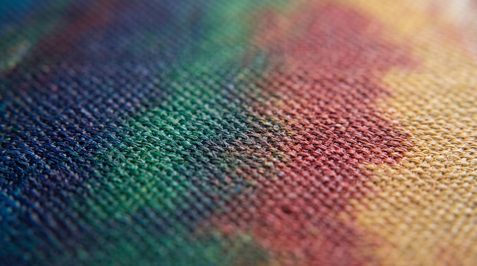 Close-up of a colourful printed canvas showing its woven texture