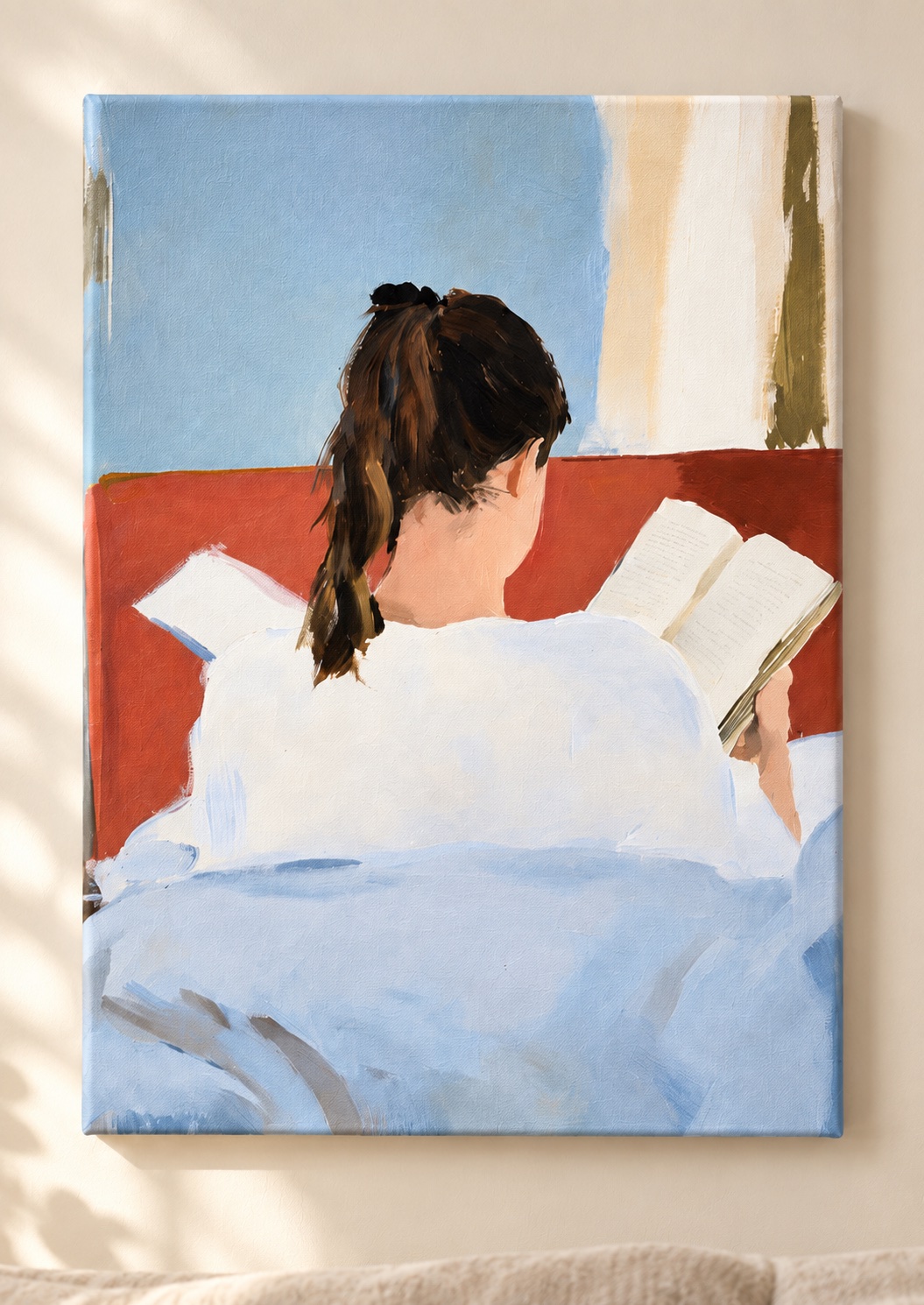 Back view of a dark-haired woman in white reading an open book on a terracotta sofa, with pale blue and cream shapes around her.