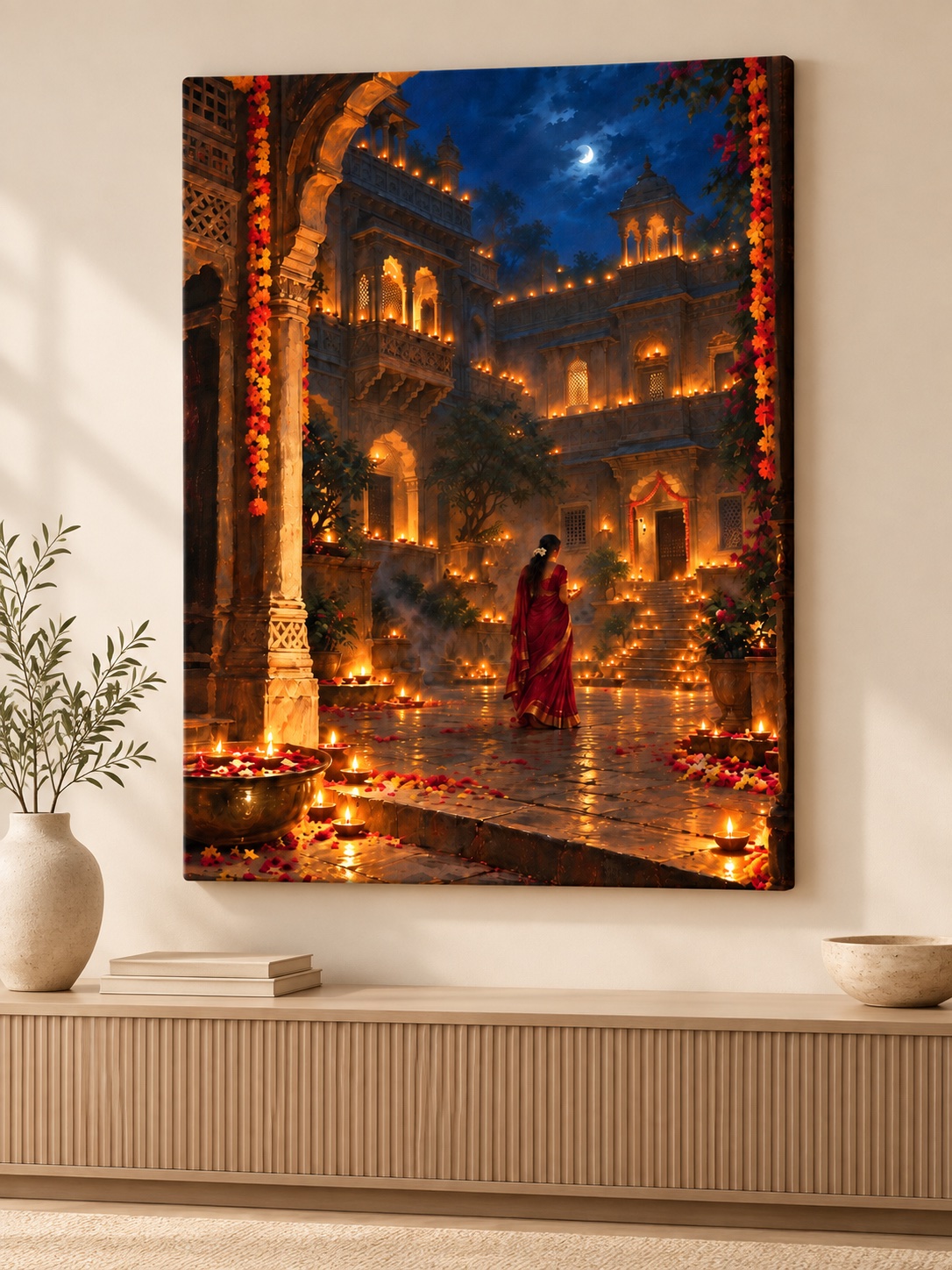 Woman in a red saree holding a diya in an ornate moonlit Indian courtyard filled with glowing lamps, marigold garlands, flower petals, and carved architecture.