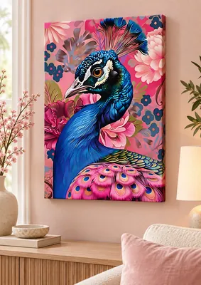 Close-up of a blue peacock with a raised crest and pink eye-patterned tail feathers against a pink floral background.