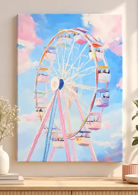 Pastel Ferris wheel with colorful passenger cabins against a bright blue sky with soft pink and white clouds.