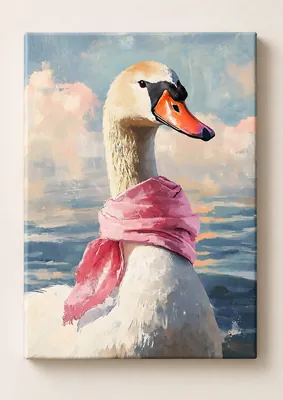 White swan with a black face marking, orange beak, and pink scarf against blue water and a pastel sky.