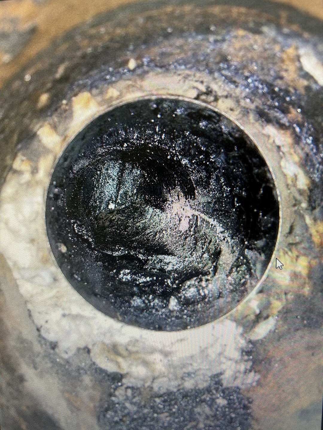 Interior view of stovepipe vent with creosote buildup