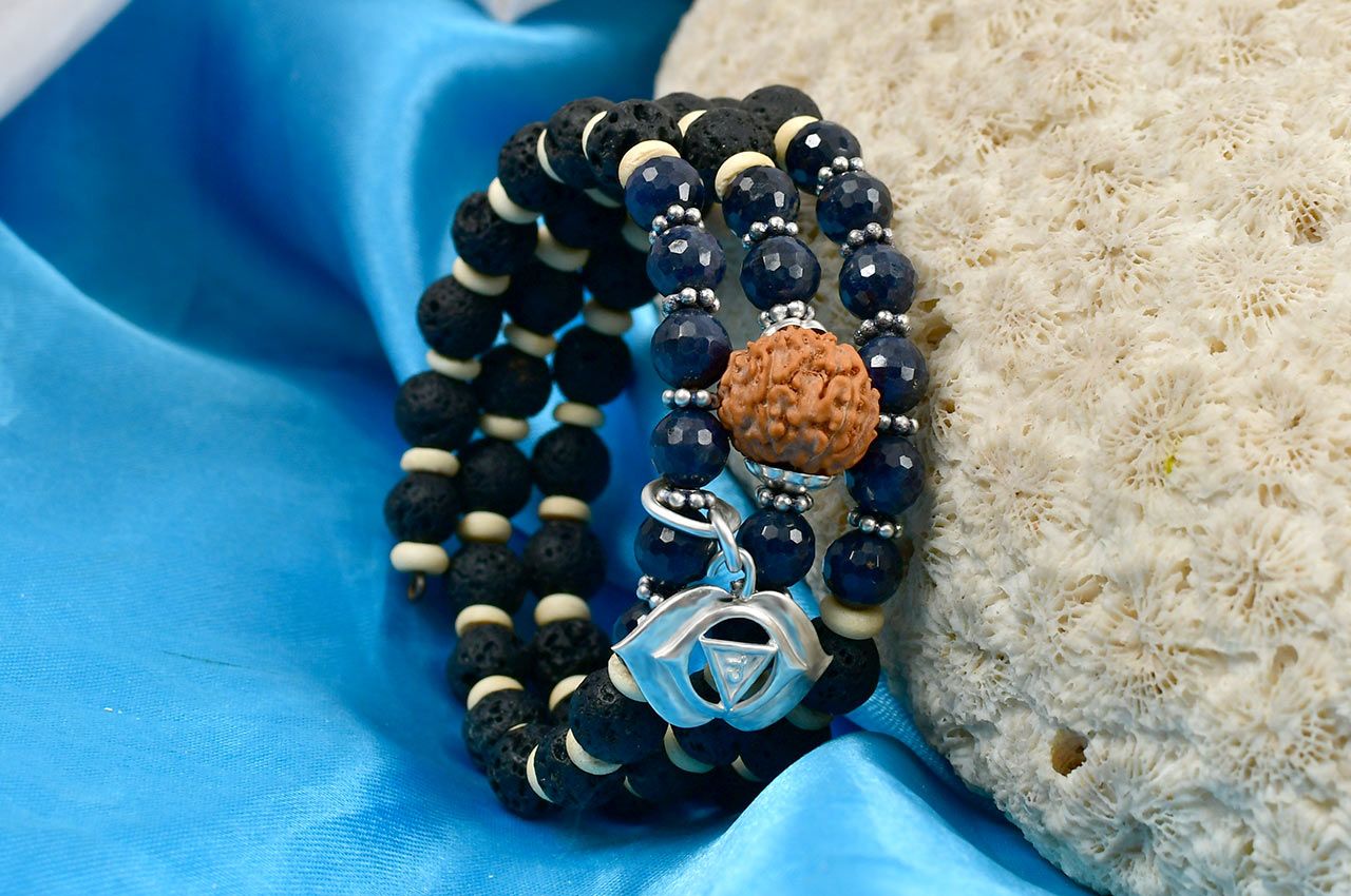 Spiral bracelet composed of natural 14 Mukhi Rudraksha bead and faceted blue sapphire gemstone beads