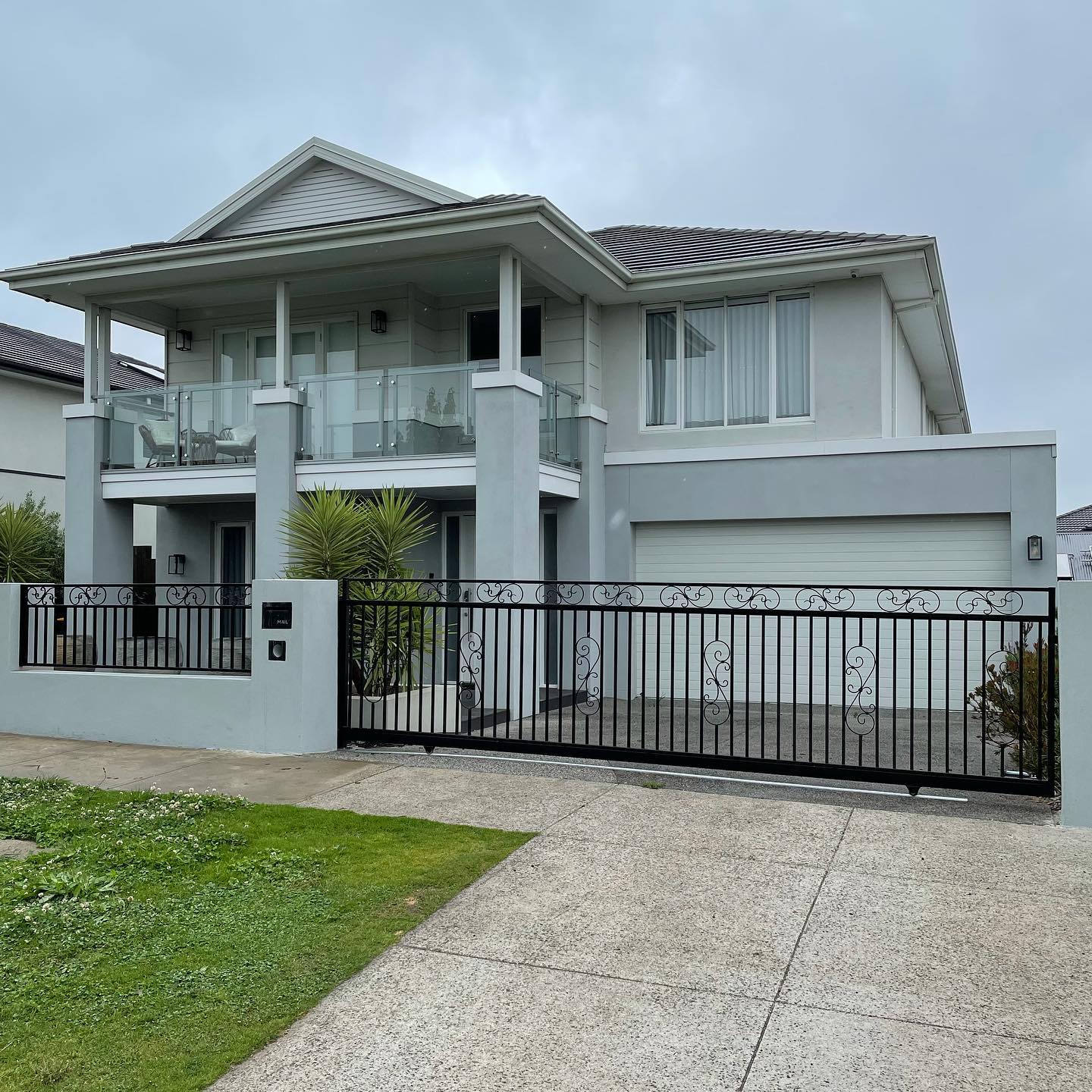 Modern house with black lacework tubular fence