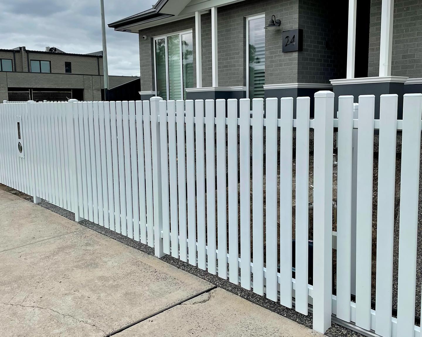 White vertical slat automatic sliding gate