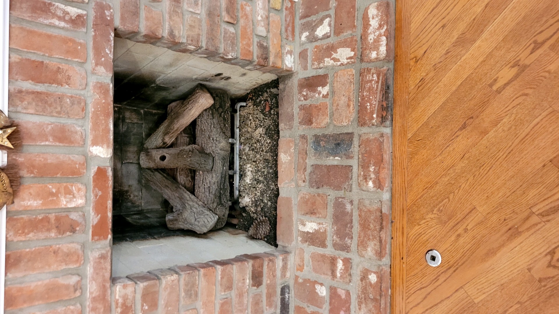 Final image showcasing restored brick fireplace