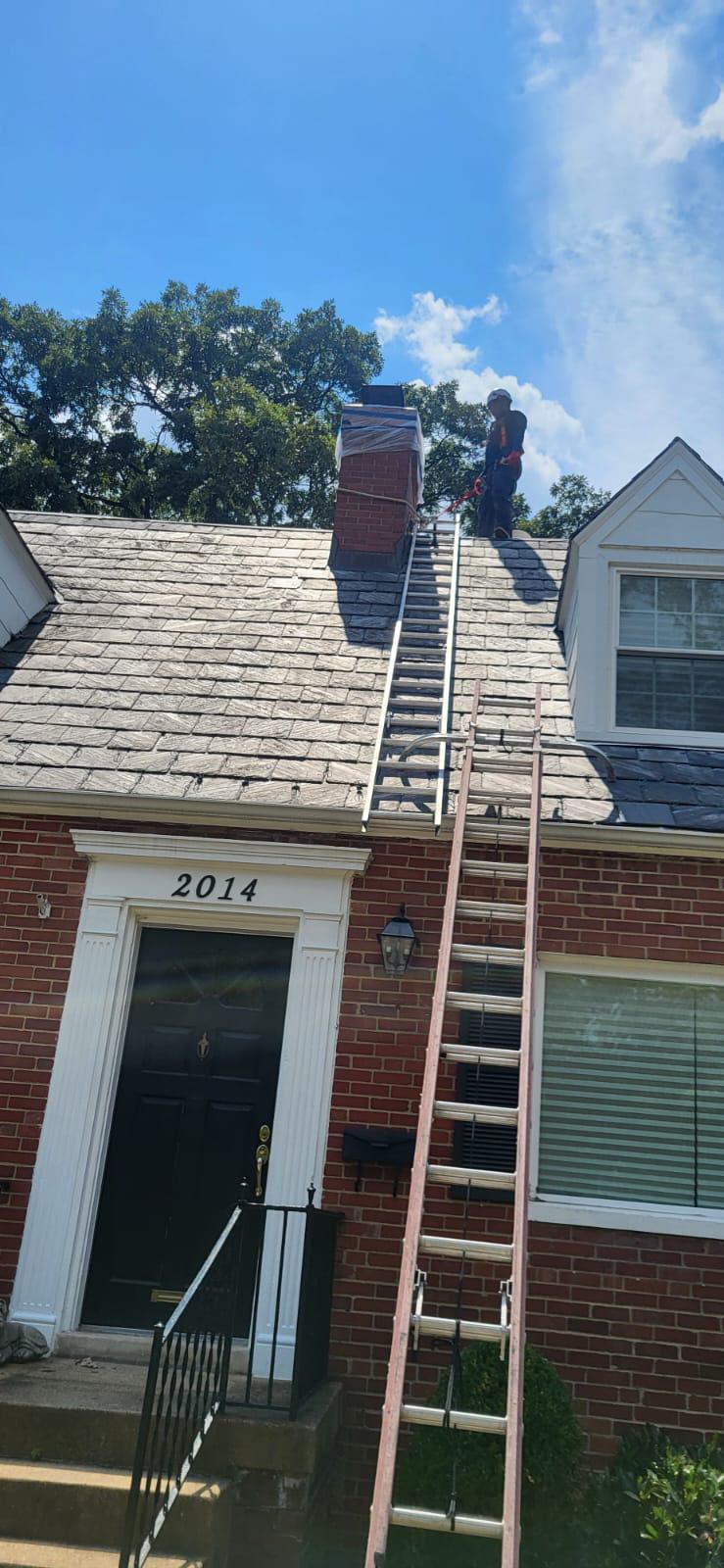 Technician preparing for mount cap installation on brick house