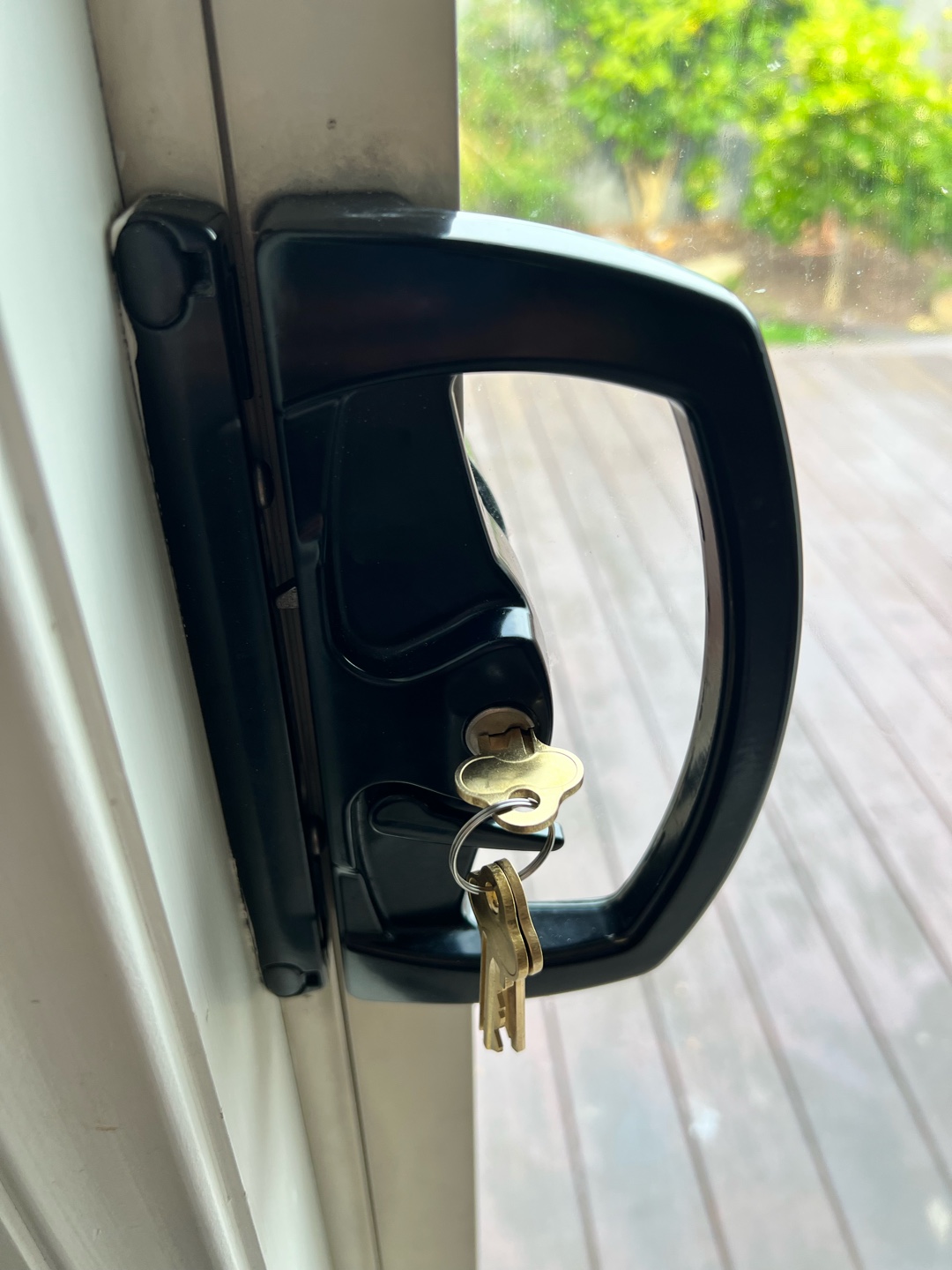 Sliding door lock mechanism with keys inserted