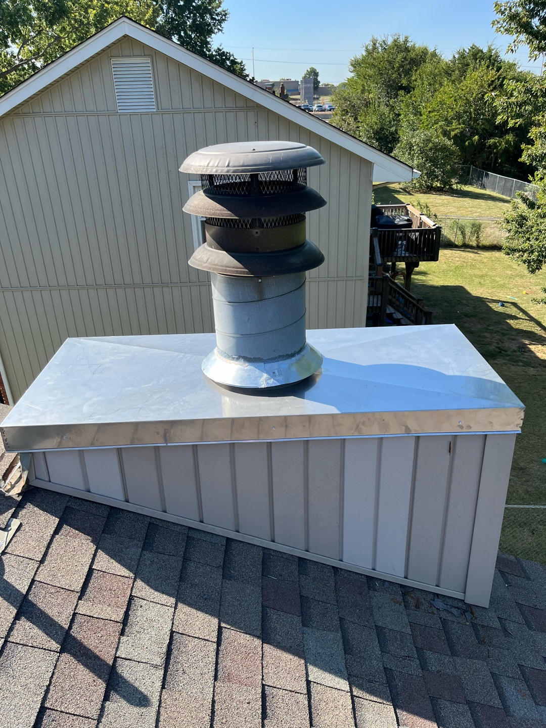 Installation of stainless steel chase cover on chimney