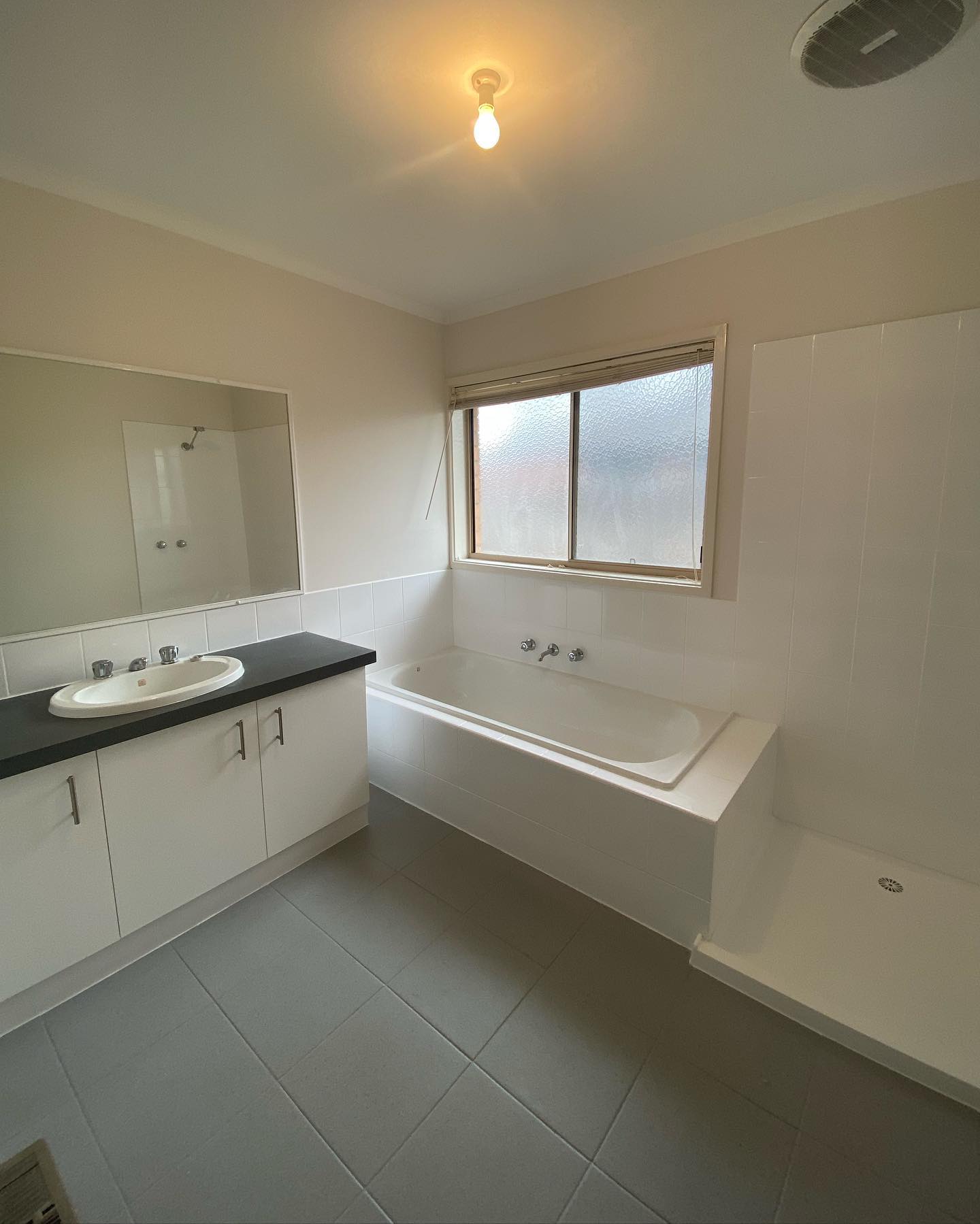 Completed bathroom renovation with modern fittings