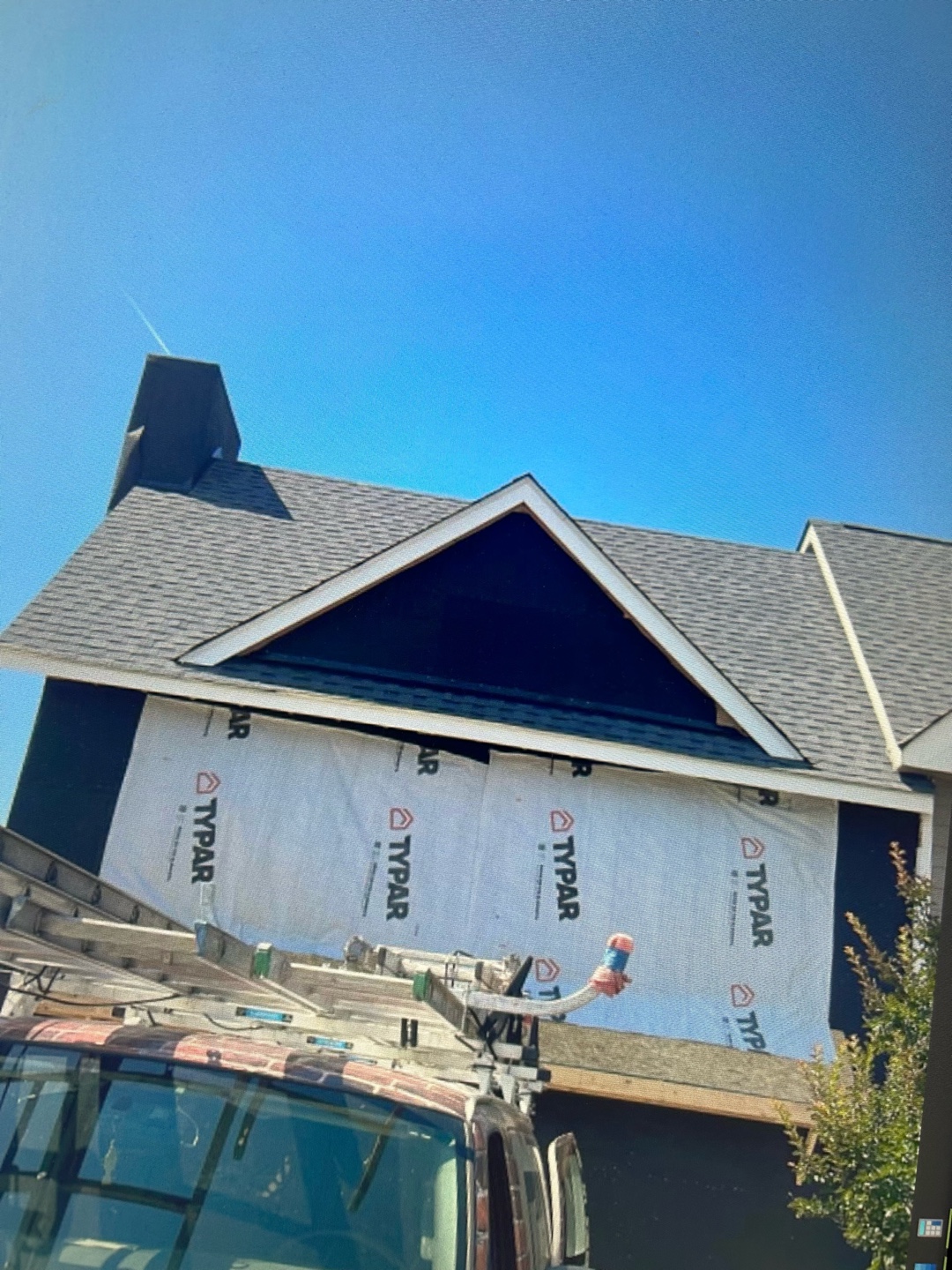 House with steeply pitched roof and chimney