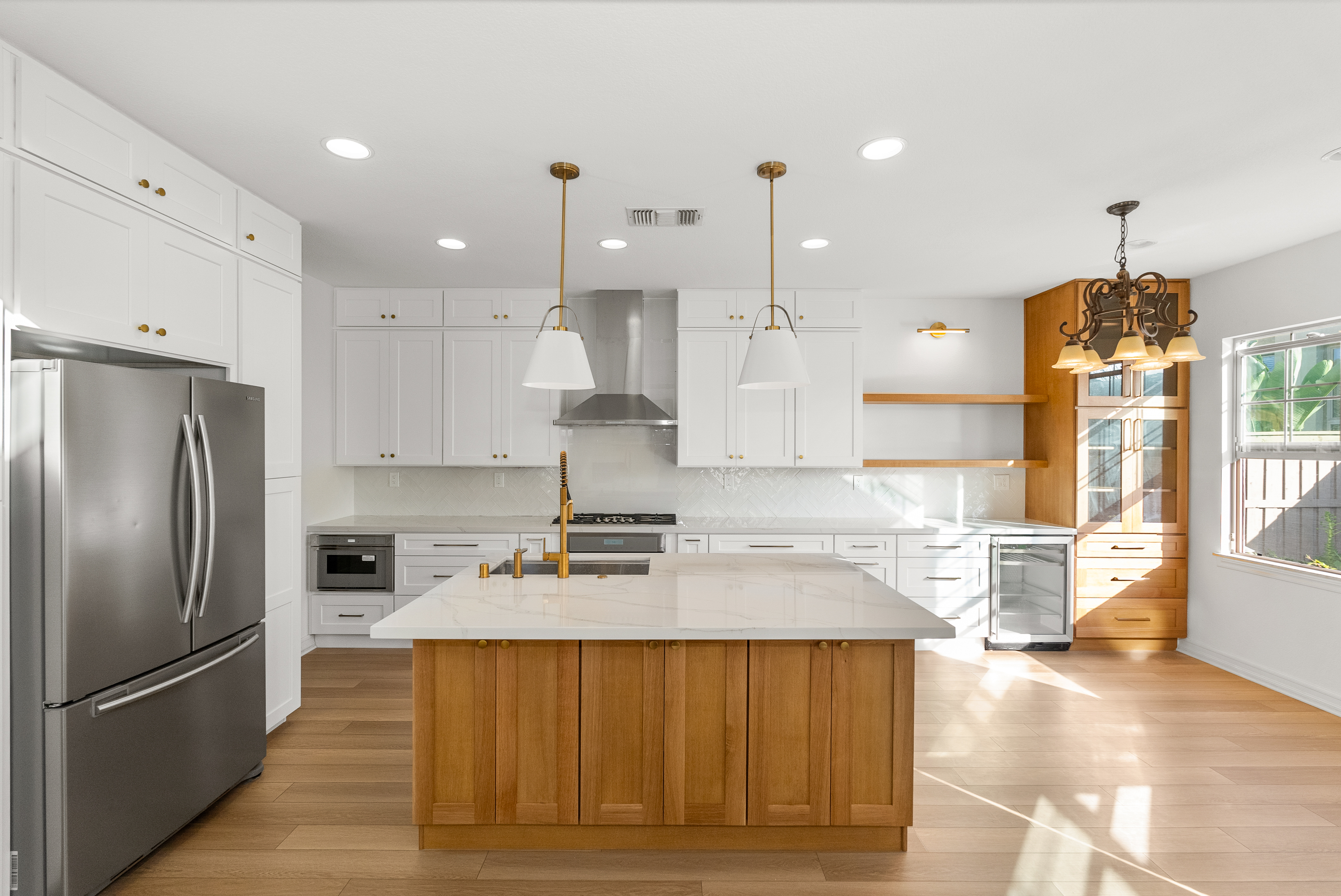 Modern kitchen with white cabinetry and quartz countertops