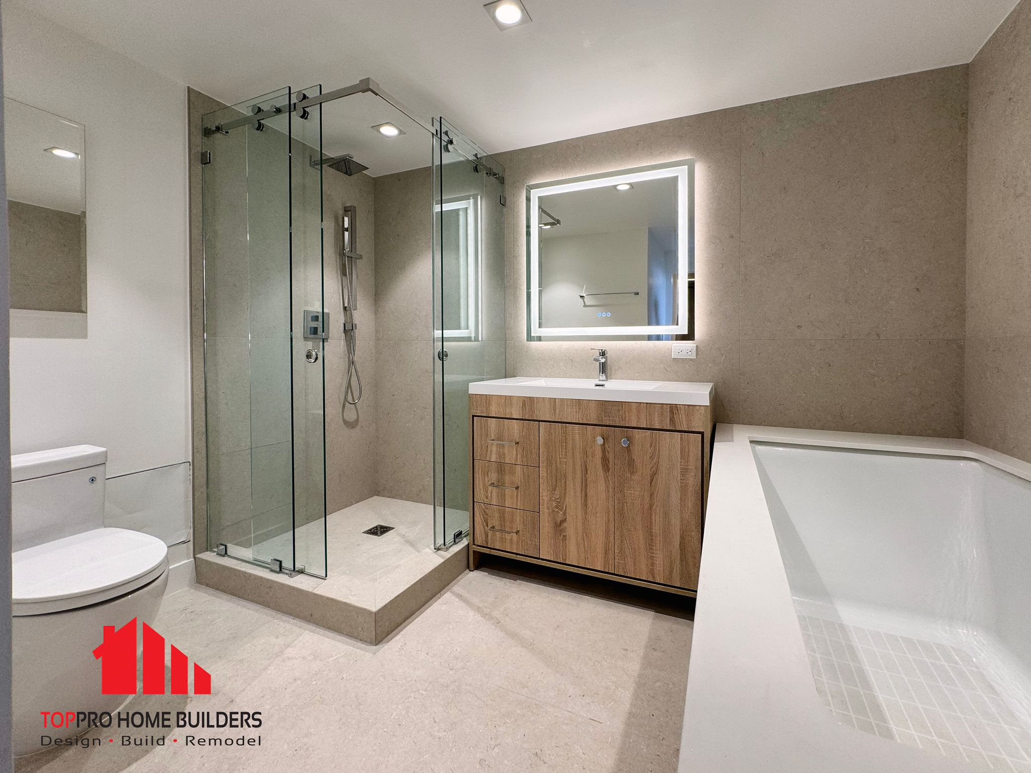 Modern bathroom with glass-enclosed shower and wooden vanity