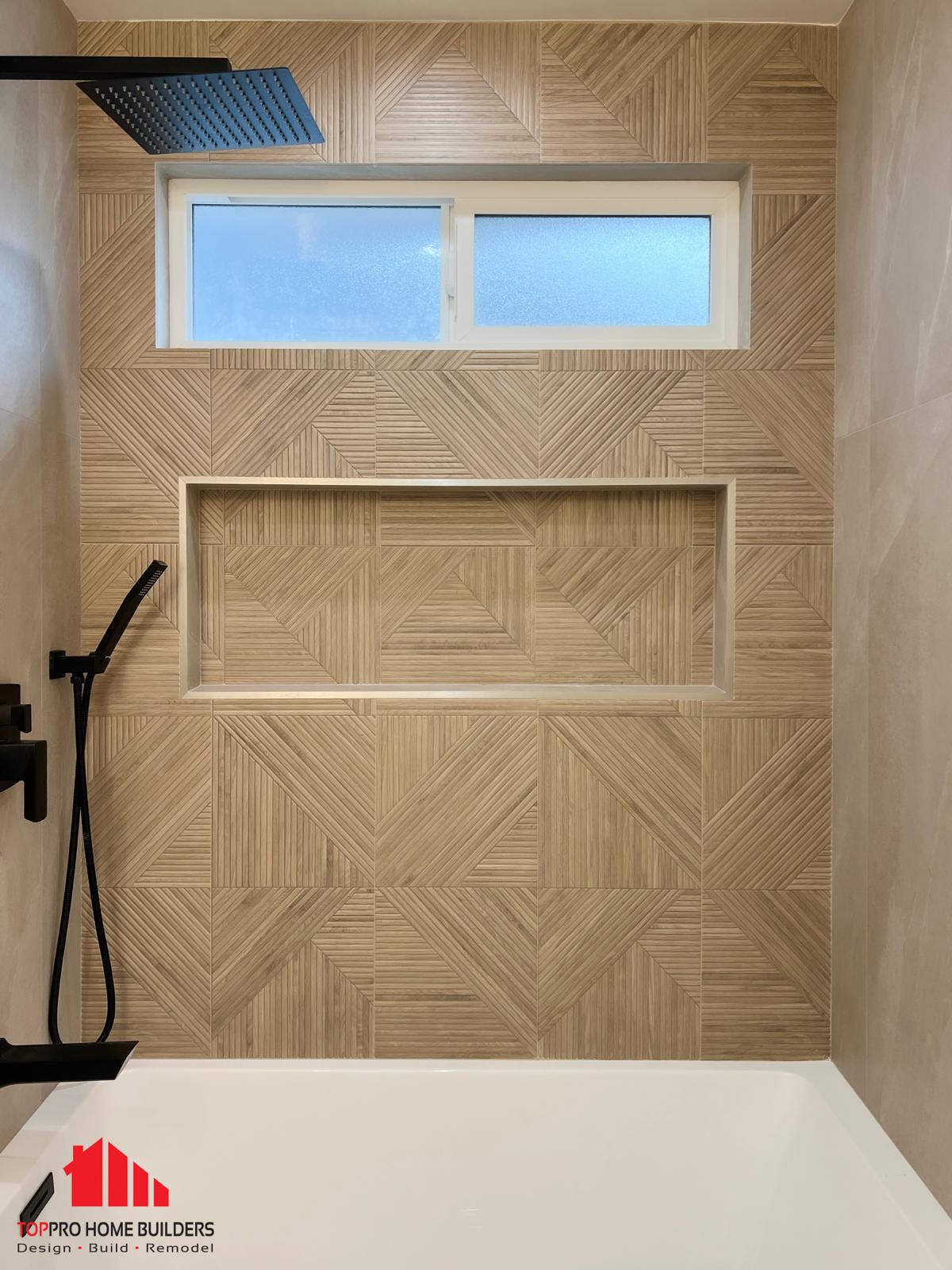 Modern bathroom shower area with geometric patterned tile wall