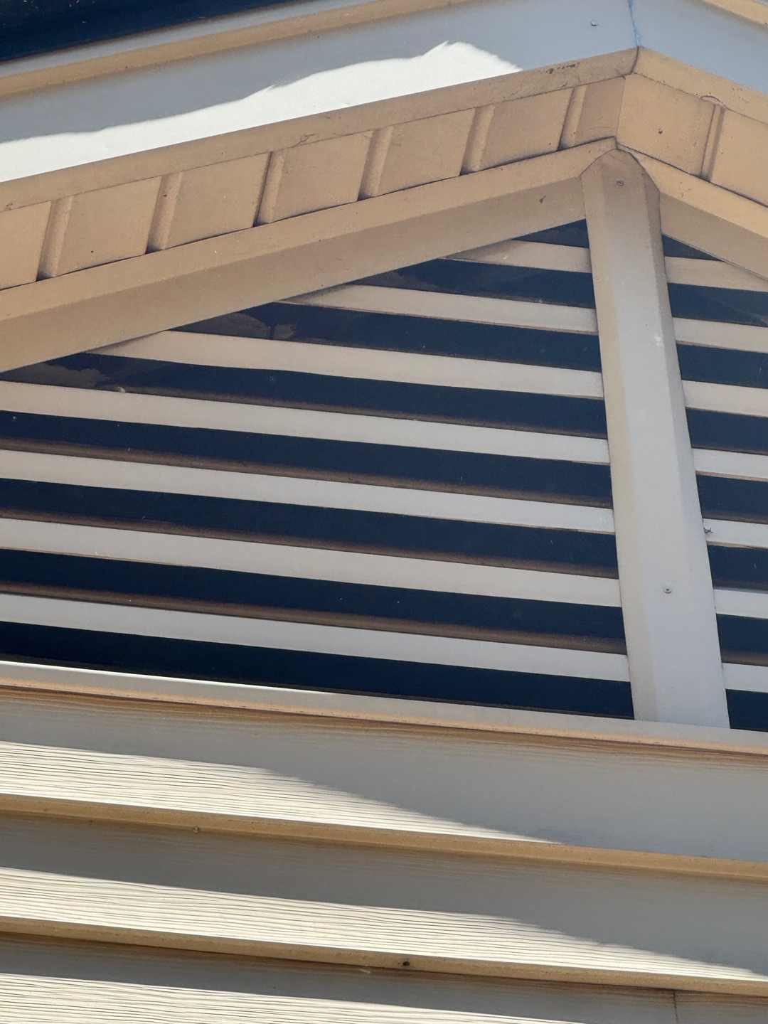 Gable vent with wide slats allowing potential animal entry