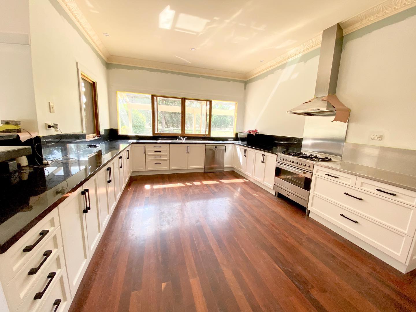 White cabinetry with black handles
