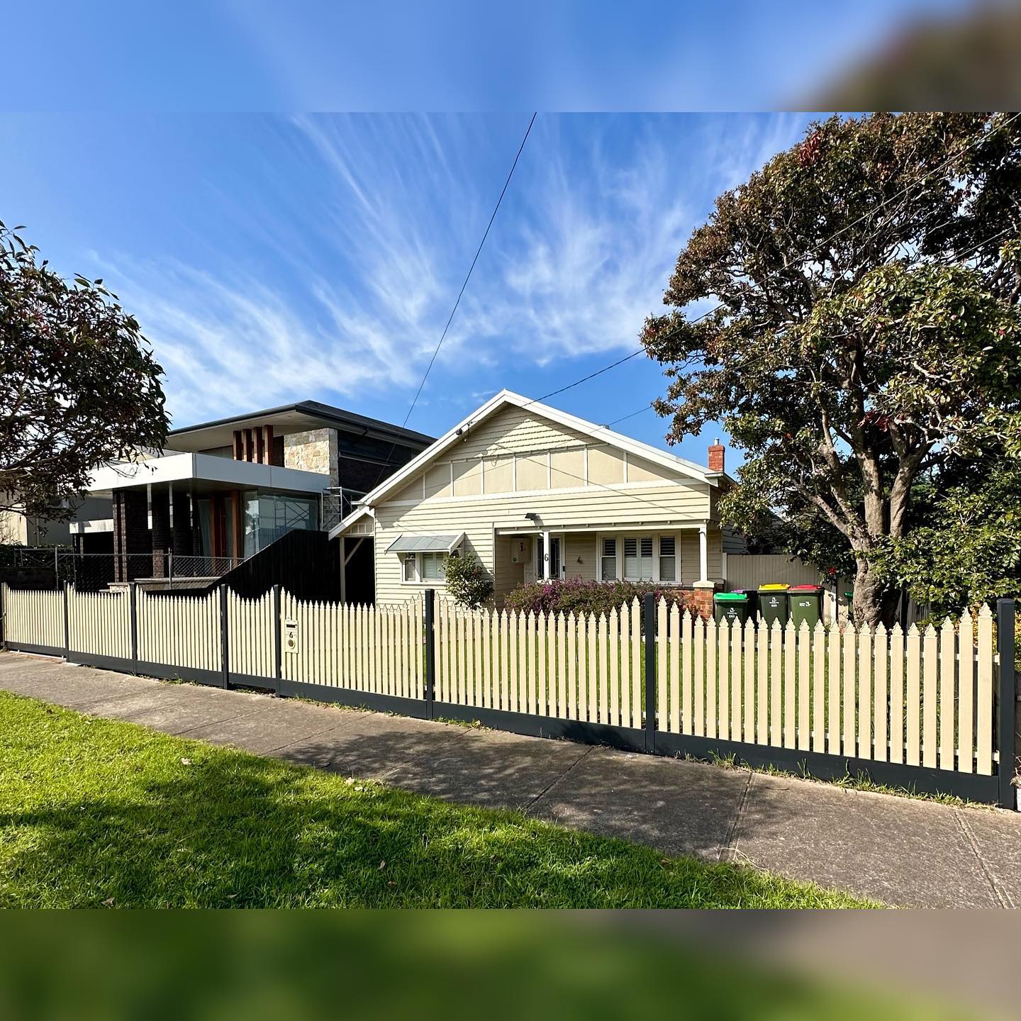 Heritage-style home with new galvanized steel fence