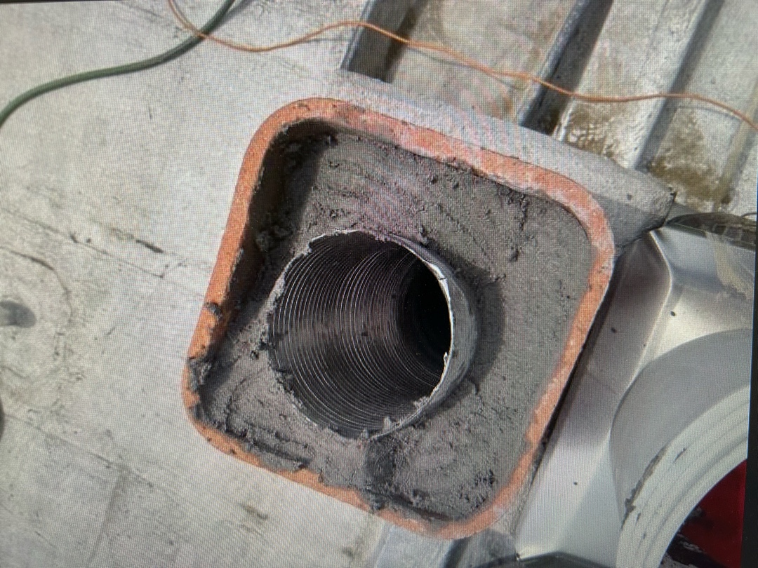 Top-down view of chimney liner installation in progress