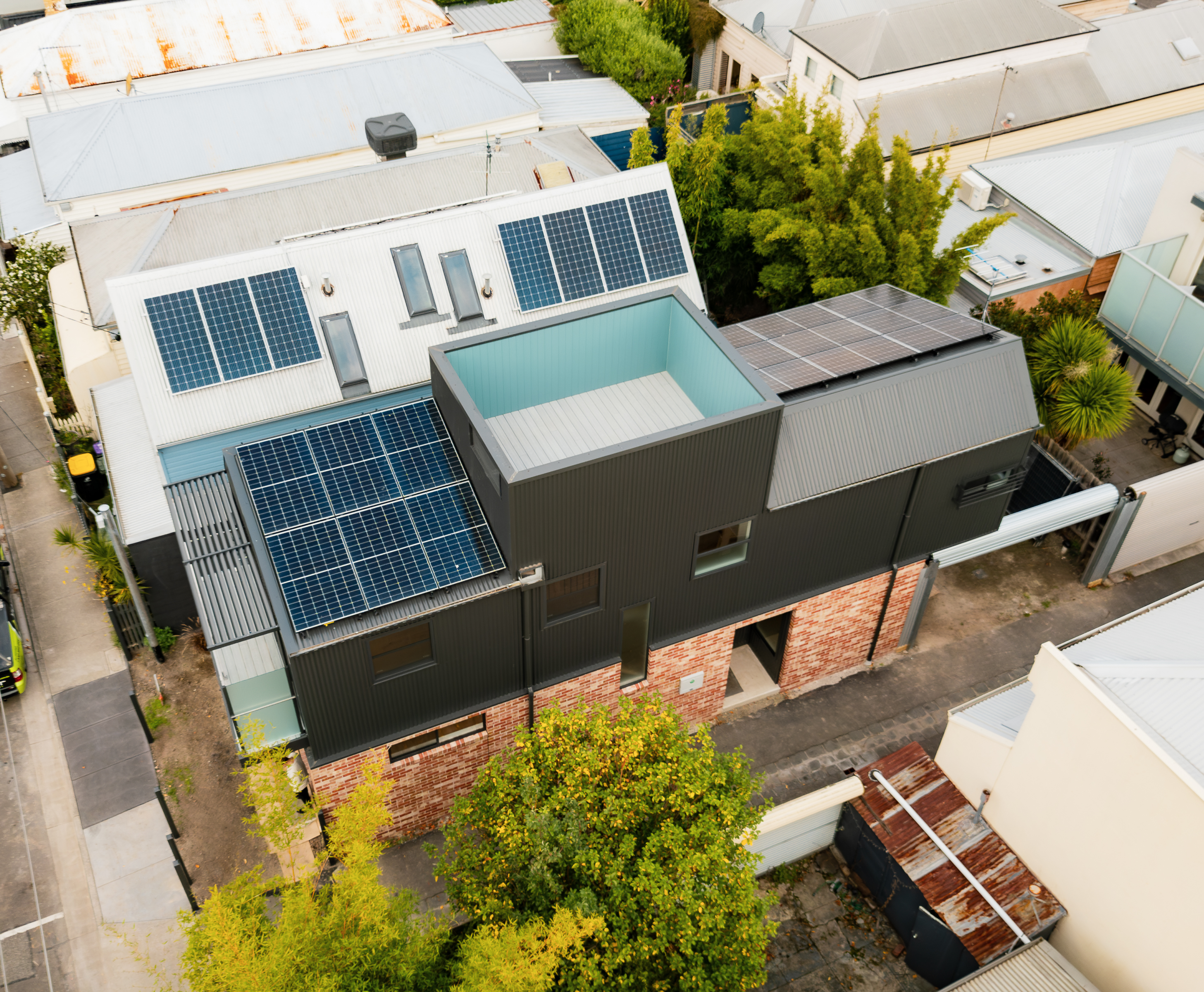 Modern double-story building with Little Hampton Blush Bricks and solar panels