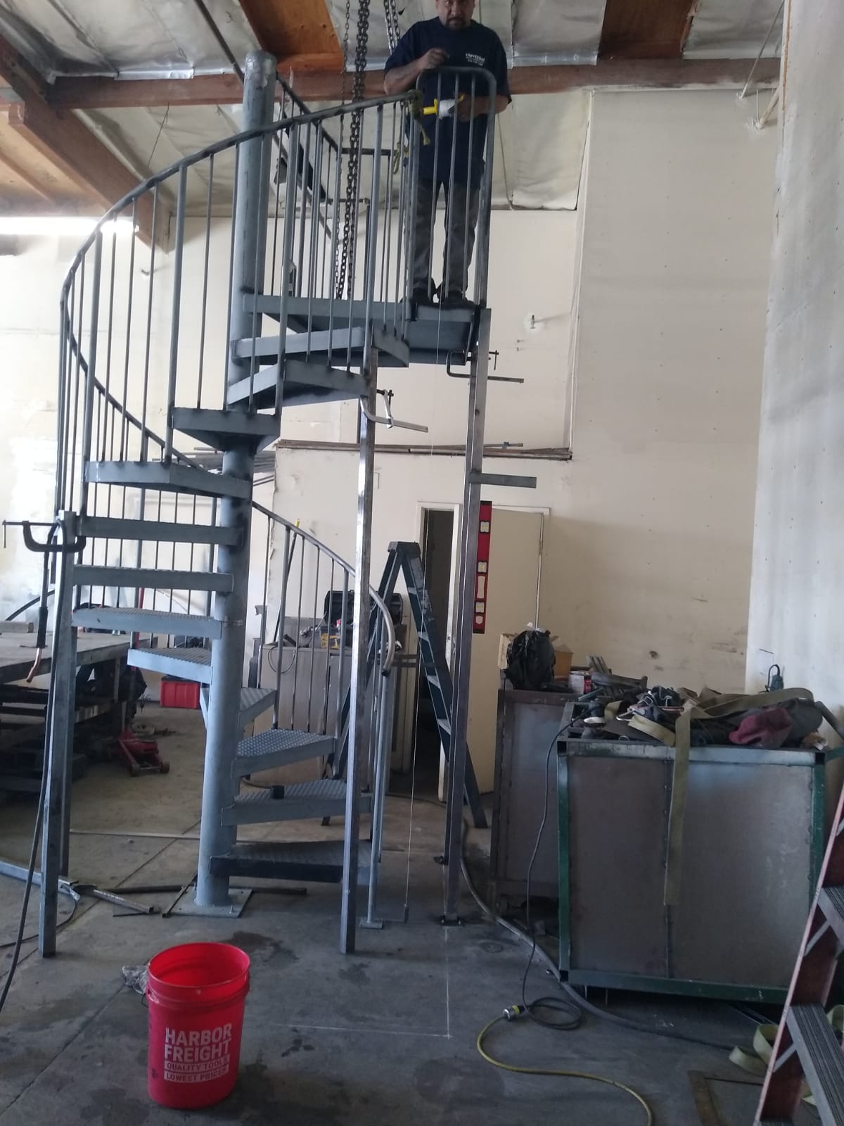Final inspection of custom spiral staircase