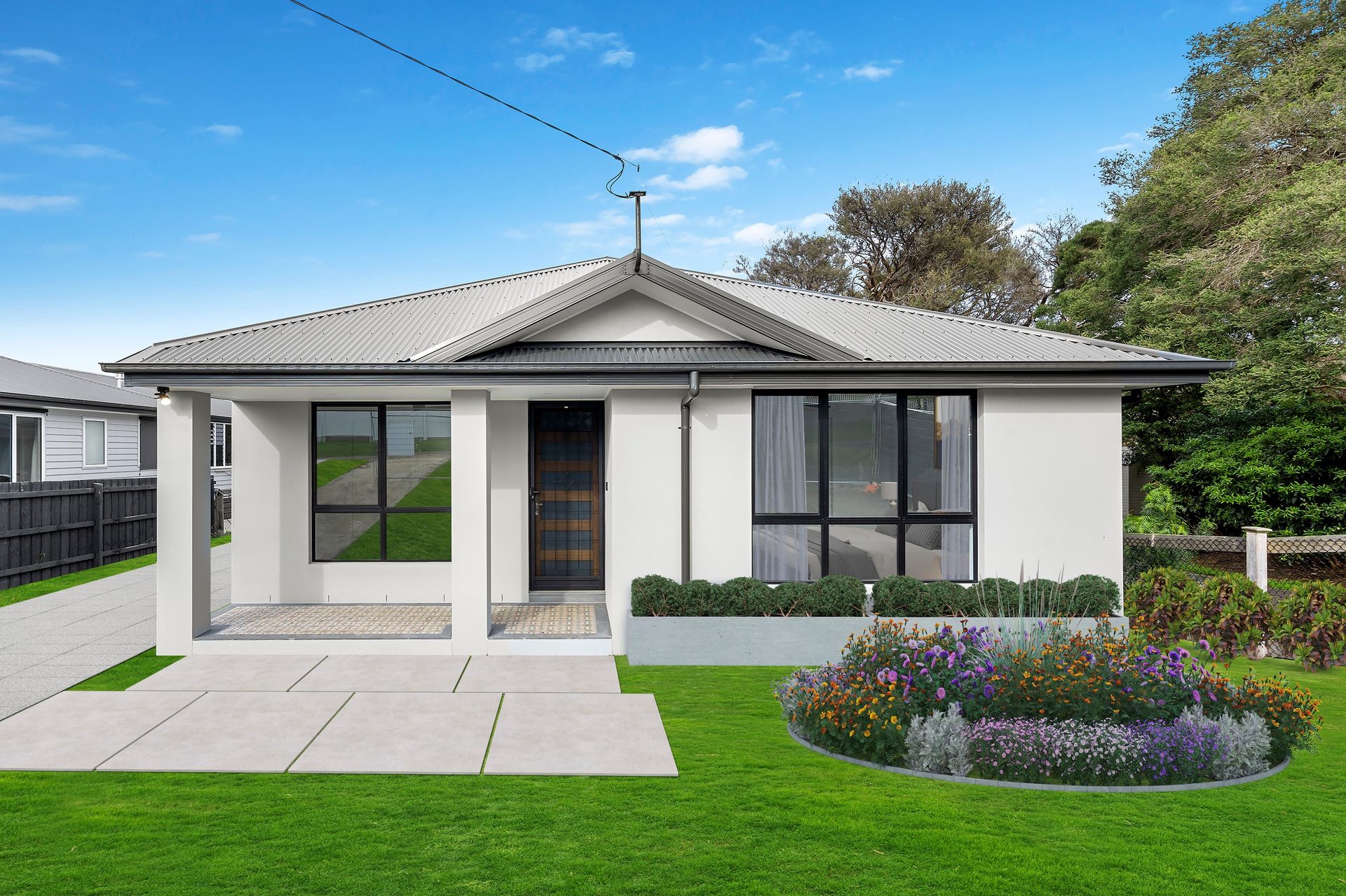 Modern single-story house with gabled roof and large front windows