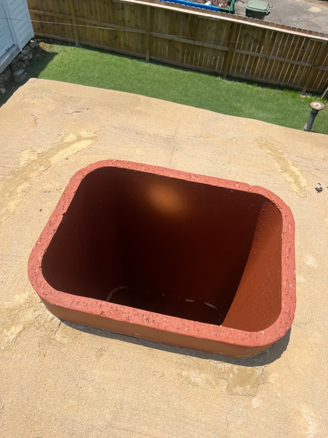 Top view of an open chimney showing its interior lining.