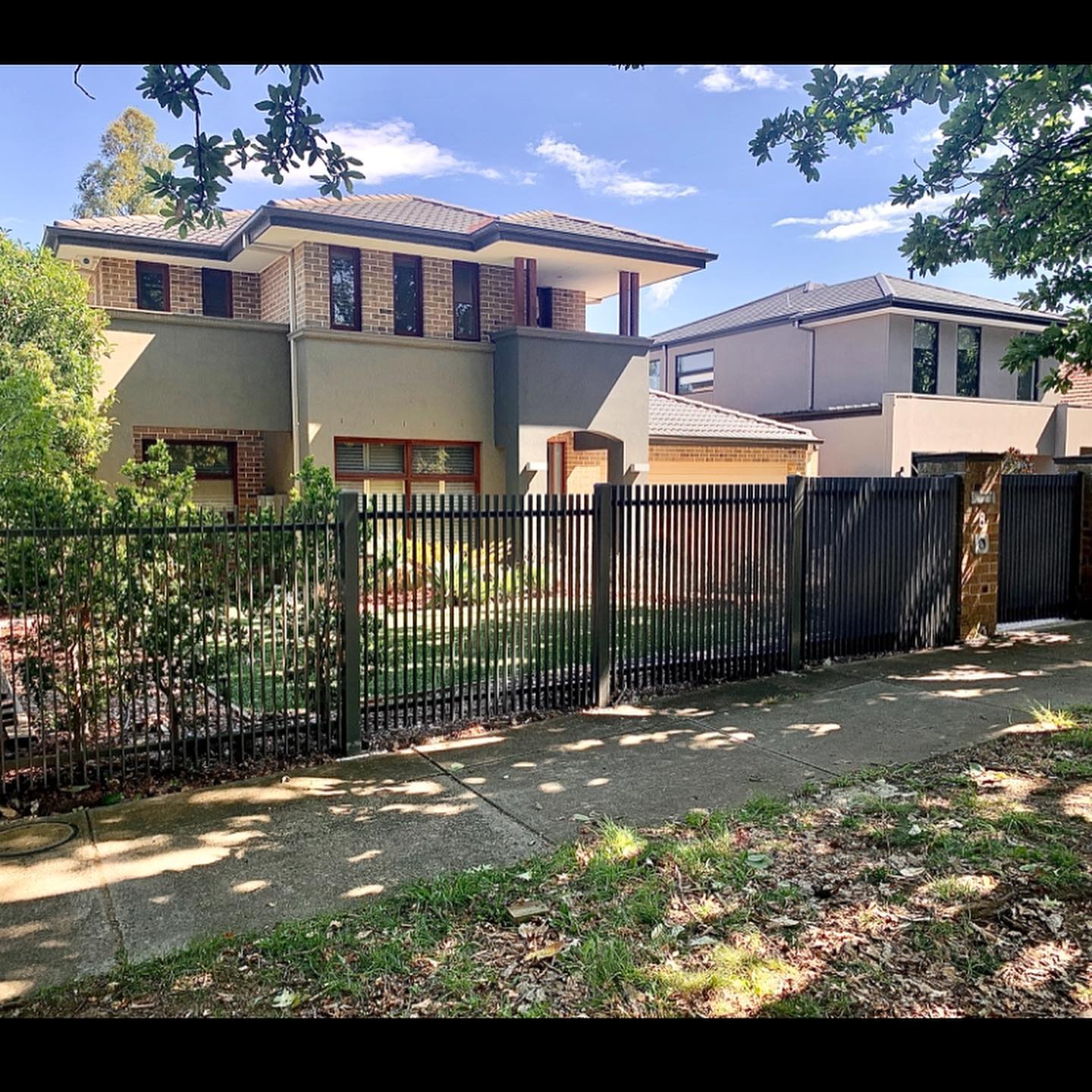 Transforming Glen Iris with a Blade Fence: A Success Story by Steel Only Pty Ltd 4 Two-story house with black blade fence