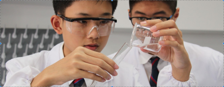 Students engaging in a science experiment at Dulwich International High School Zhuhai