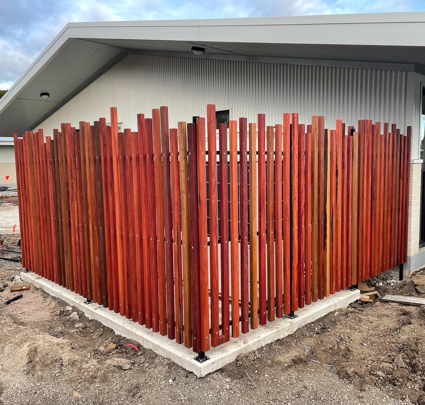 Spotted Gum Battens on Satin Black Frame: Custom Installation in Niddrie 3 Installation around building corner