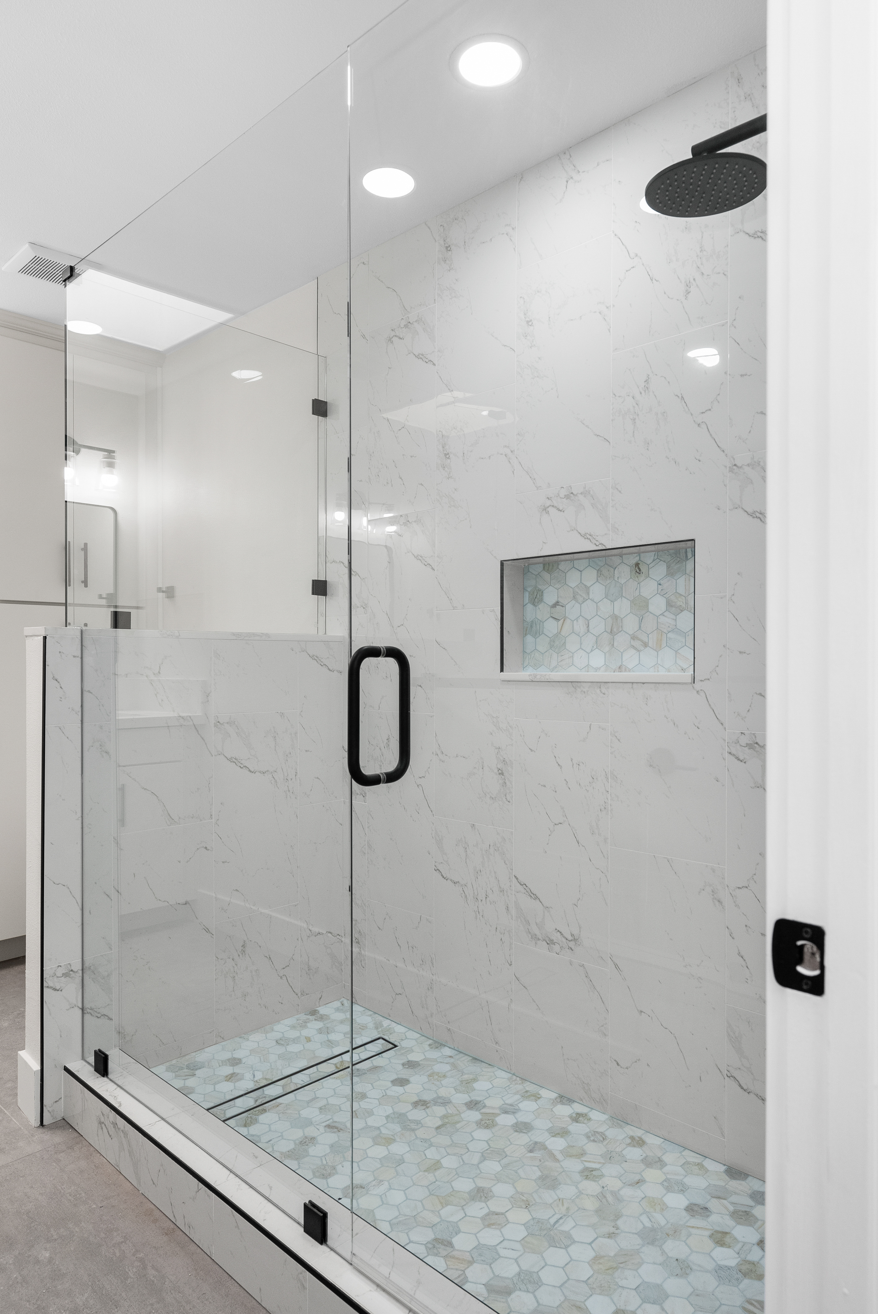 Luxurious bathroom with glass shower enclosure