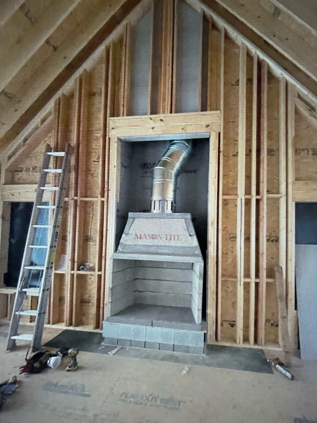 Wood insert fireplace installation in progress