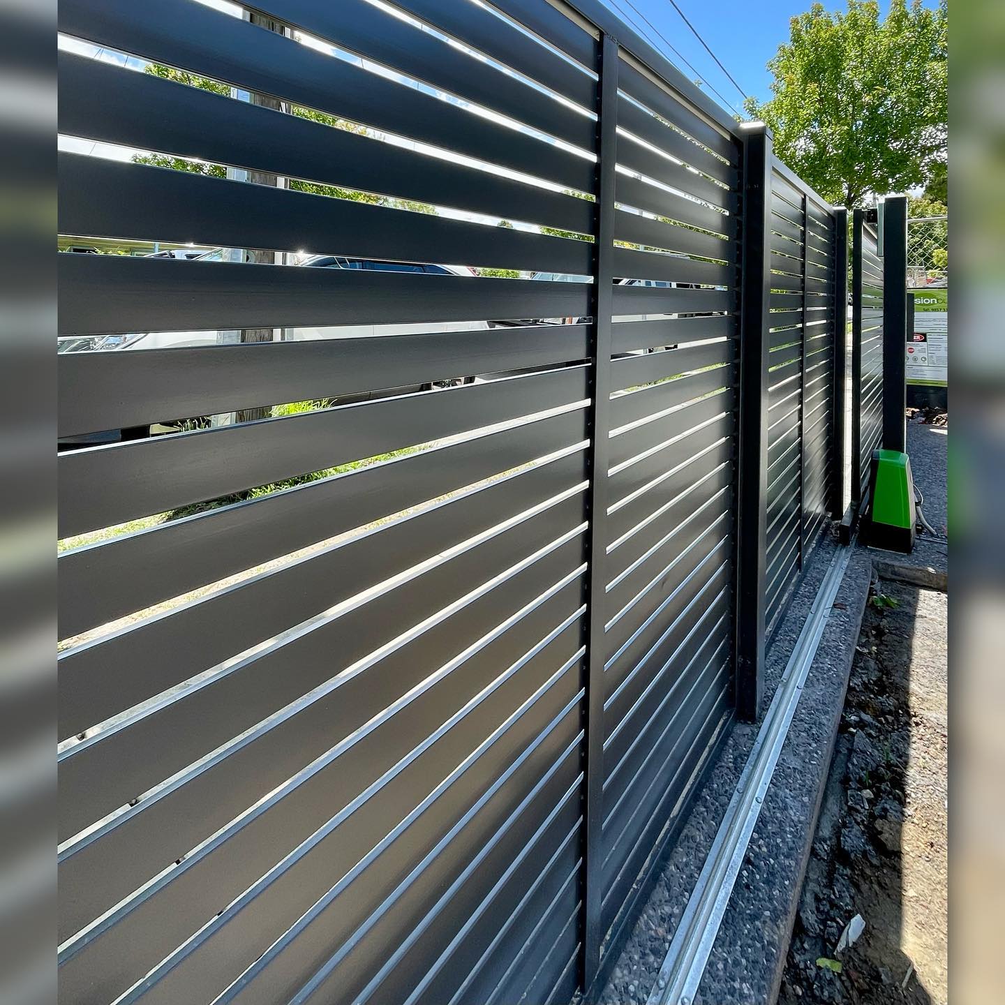 Modern Screen Fence Installation in Preston Featuring the D5 Smart Gate Motor 4 Sliding gate motor visible at end of modern screen fence