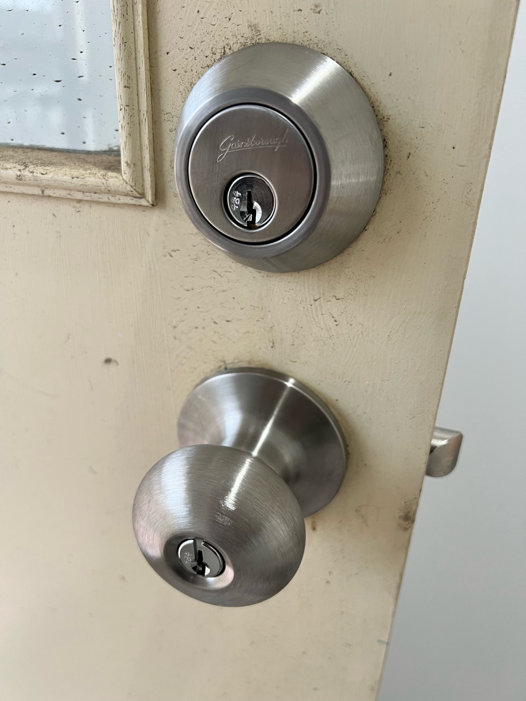 Newly installed deadbolt lock on wooden door