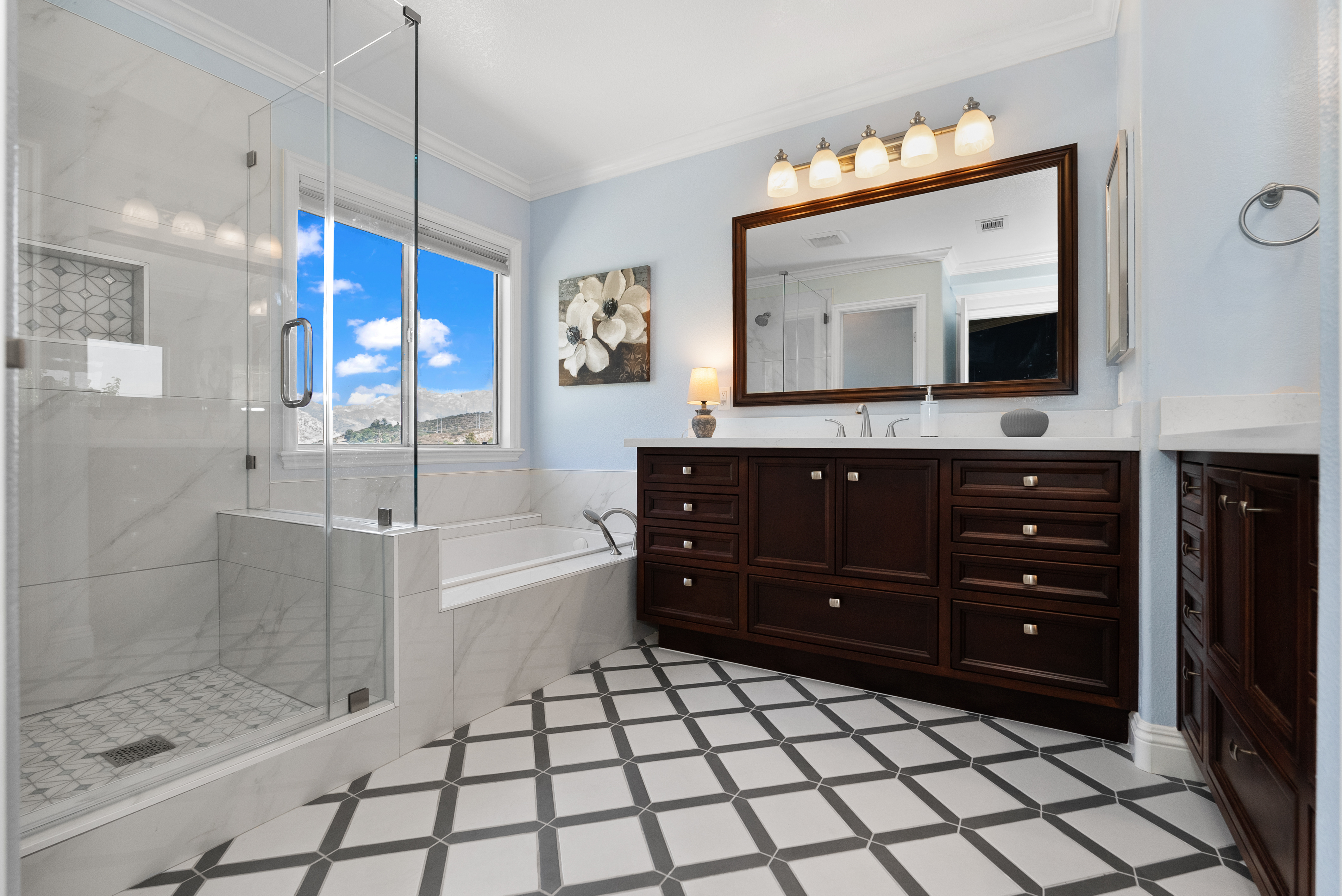 Elegant bathroom vanity with dark wood cabinetry