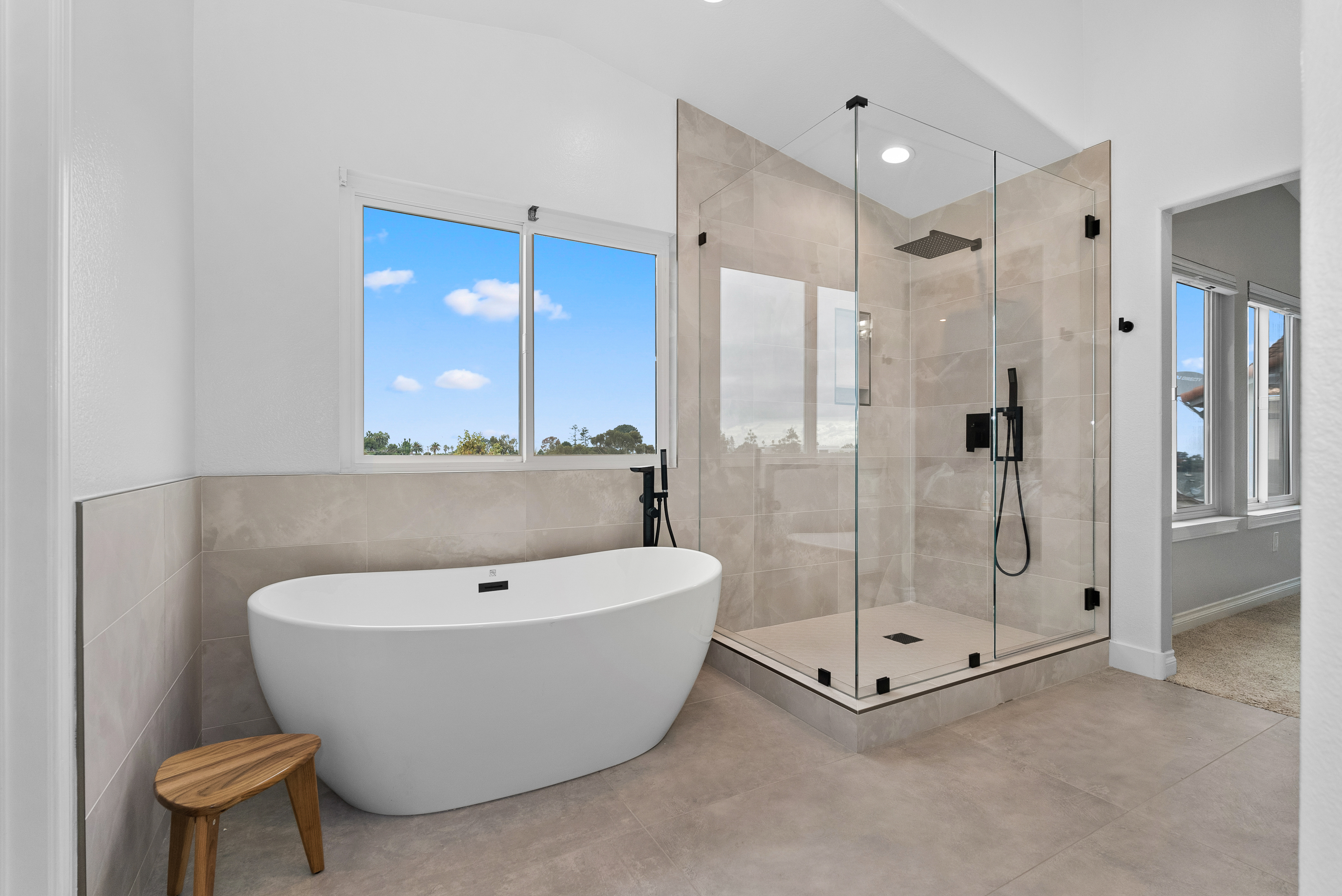 Elegant master bathroom with modern fixtures and a freestanding tub