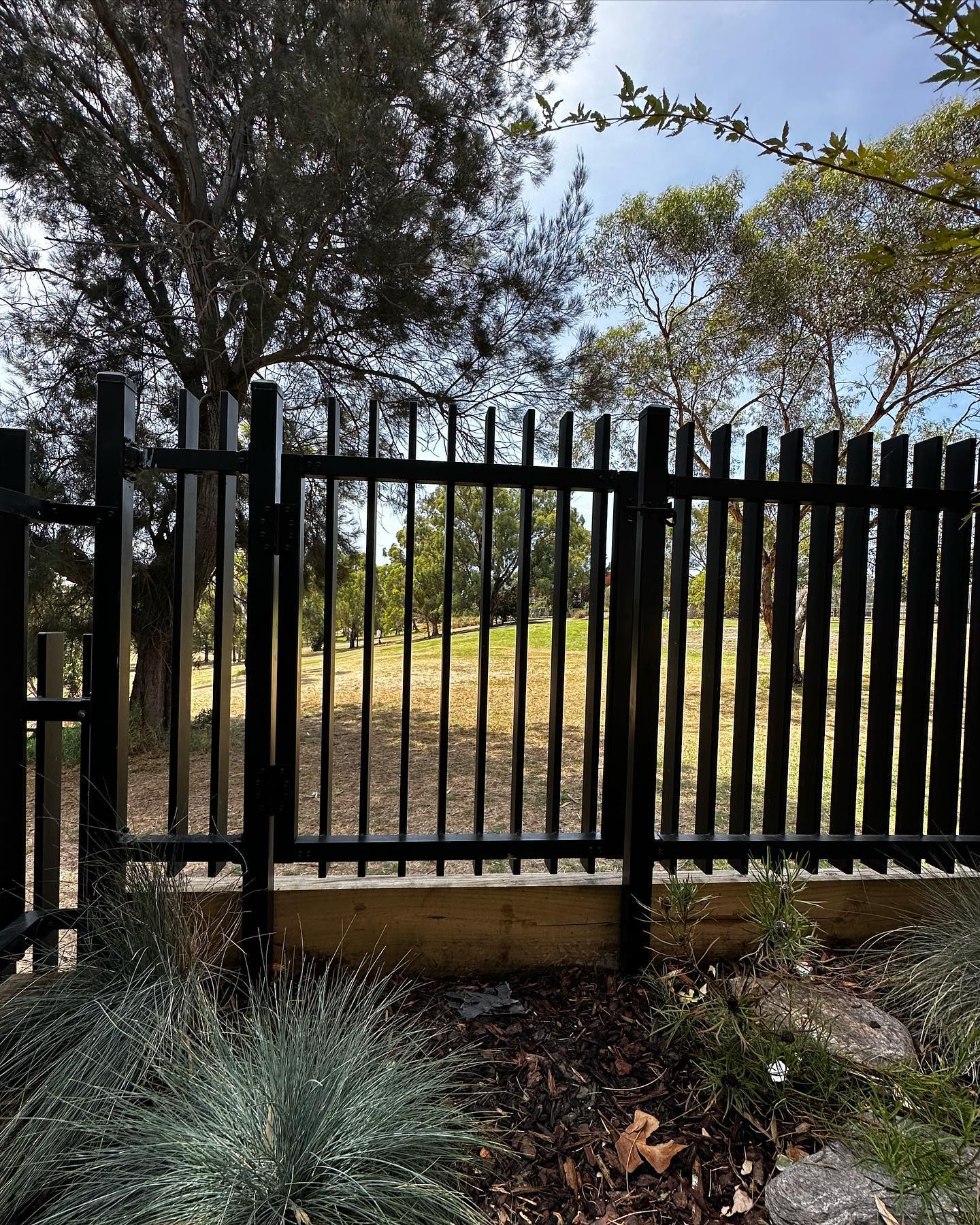 Creating Secure Park Access for a Northcote Townhouse 2 Black metal fence with vertical bars integrated pedestrian access gate